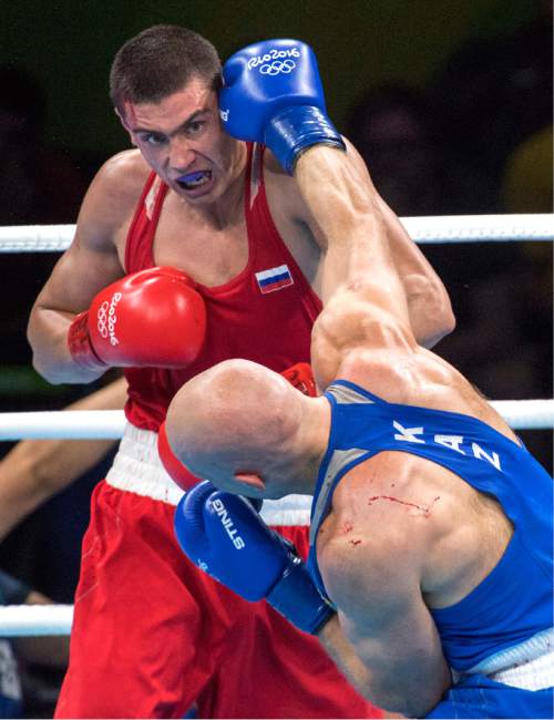 Rick Egan  |  The Salt Lake Tribune

 Vassiliy Levit of Kazakhstan (blue) fights Evgeny Tishchenko (red) in the Olympic boxing, in the Men's 91KG  Final bout, at Riocentro Pavilion 6, in Rio de Janeiro, Monday, August 15, 2016.
