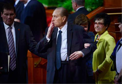 Scott Sommerdorf   |  The Salt Lake Tribune  
President Thomas S. Monson blows kisses to some in the audience as he leaves the morning session of the 186th annual General Conference of the LDS Church, Sunday, April 3, 2016.