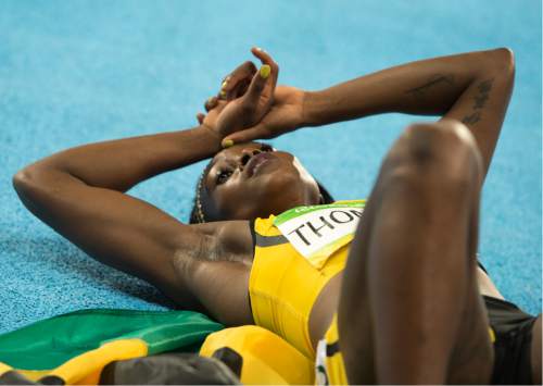 Rick Egan  |  The Salt Lake Tribune

Jamaica's Elaine Thompson, recovers after winning the gold in the women's 200-meter final, at Olympic Stadium, in Rio de Janeiro, Wednesday, August 17, 2016.