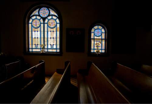 Jim Urquhart  |  The Salt Lake Tribune
Stained glass lights the pews in Price's Assumption of the Virgin Mary Greek Orthodox Church, shown in 2010. The church is poised to celebrate its 100th anniversary.