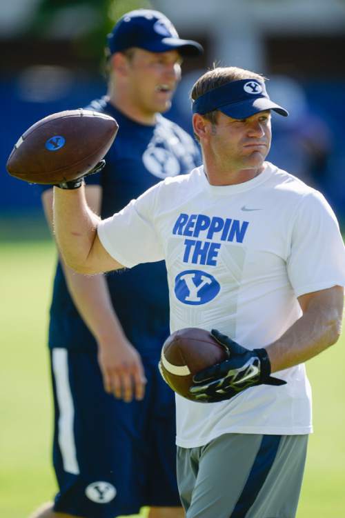 Francisco Kjolseth | The Salt Lake Tribune
BYU's receiving corps, led by new wide receiver coach Ben Cahoon, take to the practice field on Tuesday, Aug. 16, 2016.