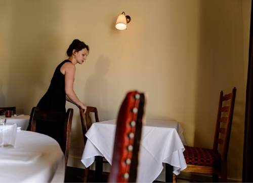 Trent Nelson  |  The Salt Lake Tribune
Katie Mulliken sets a table at Veneto, a new fine-dining restaurant in Salt Lake City that has adopted a no-tipping policy. Instead, the Italian restaurant charges a nominal fee or "coperto" of $3 per guest -- similar to what is done in Veneto, Italy.