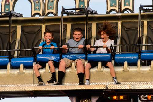 Trent Nelson  |  The Salt Lake Tribune
McCoy Matthews, Austin Mitchell, and Bridger Matthews ride the Gee Wizz on the opening day of the Salt Lake County Fair, Wednesday August 17, 2016, marking its 80th year with traditional fair events and modern entertainment. The Fair continues through the weekend at the Salt Lake County Equestrian Center in South Jordan.