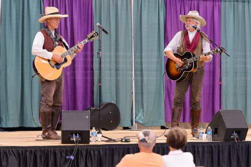 Trent Nelson  |  The Salt Lake Tribune
Craig "Creek" Johnson and Lannie "The Marshal" Scopes perform as the cowboy act Hired Guns on the opening day of the Salt Lake County Fair, Wednesday August 17, 2016, marking its 80th year with traditional fair events and modern entertainment. The Fair continues through the weekend at the Salt Lake County Equestrian Center in South Jordan.