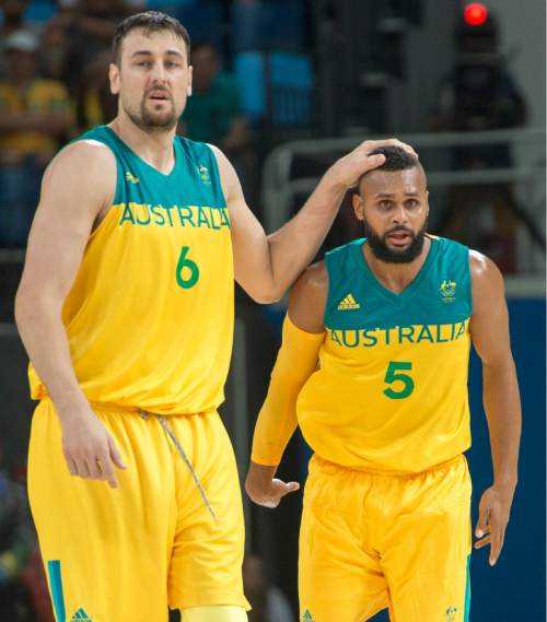 Rick Egan  |  The Salt Lake Tribune

Andrew Bogut (6) pats Patty Mills (5) of Australia on the head, after he hit a bit r-point shot, in mens Olympics quarter final basketball action, Australia vs.Lithuania, at Carioca Arena, in Rio de Janeiro, Monday, August 15, 2016.