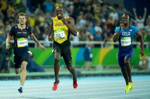 Rick Egan  |  The Salt Lake Tribune

Usain Bolt wins the 200-meters in 19.79 seconds. He has now won the 100m and 200m at three consecutive Olympics. De Grasse takes silver and Lemaitre third, at Olympic Stadium, in Rio de Janeiro, Thursday, August 18, 2016.