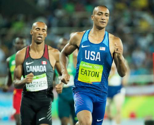 Rick Egan  |  The Salt Lake Tribune

Gold medal winner Ashton Eaton runs just a head of bronze medal winner,  Damian Warner, Canada, in decathlon1500-meters, at Olympic Stadium, in Rio de Janeiro, Thursday, August 18, 2016.

 Eaton's final score in the decathlon of 8,893 points ties the Olympic record held by Roman Sebrle of the Czech Republic.