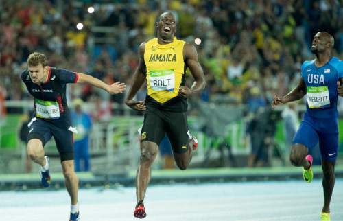 Rick Egan  |  The Salt Lake Tribune

Usain Bolt wins the 200-meters in 19.79 seconds. He has now won the 100m and 200m at three consecutive Olympics. De Grasse takes silver and Lemaitre third, at Olympic Stadium, in Rio de Janeiro, Thursday, August 18, 2016.