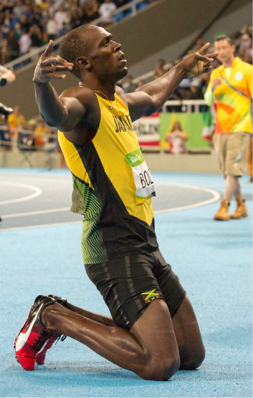 Rick Egan  |  The Salt Lake Tribune

Usain Bolt, after winning the 200-meters in 19.79 seconds. He has now won the 100m and 200m at three consecutive Olympics. De Grasse takes silver and Lemaitre third, at Olympic Stadium, in Rio de Janeiro, Thursday, August 18, 2016.