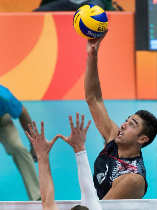 Rick Egan  |  The Salt Lake Tribune

Taylor Sander (3) of United States, hits the ball past in Men's Olympic volleyball action at Ginásio do Maracanãzinho, in Rio de Janeiro, Sunday, August 7, 2016.