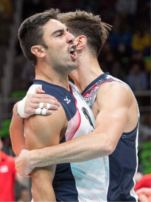 Rick Egan  |  The Salt Lake Tribune

Taylor Sander (3) celebrates with Aaron Russell (2) of United States after defeating Brazil, in volleyball action USA vs. Brazil, in Rio de Janeiro, Thursday, August 11, 2016.