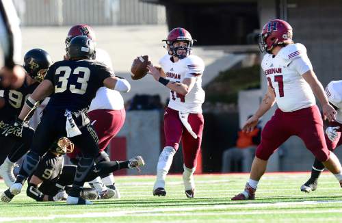 Scott Sommerdorf   |  The Salt Lake Tribune
Herriman QB Hayden Reynolds (14) looks to pass during first half play.  Herriman led Lone Peak 10-0 at  the half, Friday, November 20, 2015.