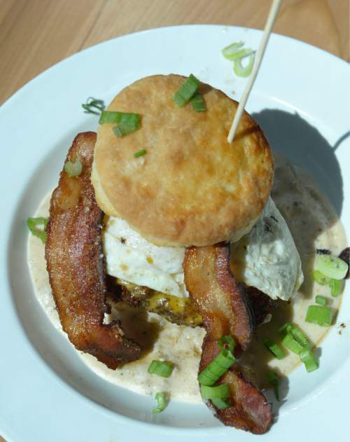 Al Hartmann  |  The Salt Lake Tribune 
The "Hoss," a fresh-baked biscuit, with fried-chicken breast, egg, bacon, cheddar and sausage gravy at Sweet Lake Limeade and Biscuits.