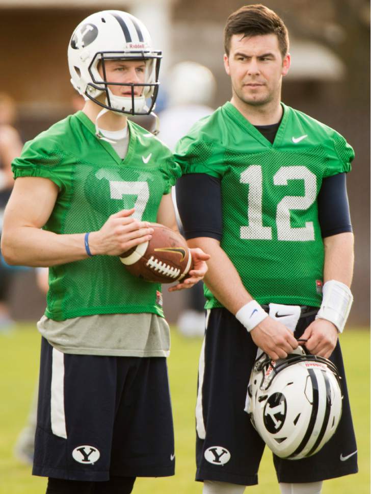 Rick Egan  |  The Salt Lake Tribune

BYU quarterbacks Beau Hoge (7) and  Tanner Mangum (12) prepare for the second day of spring practice, in Provo, Thursday, March 3, 2016.