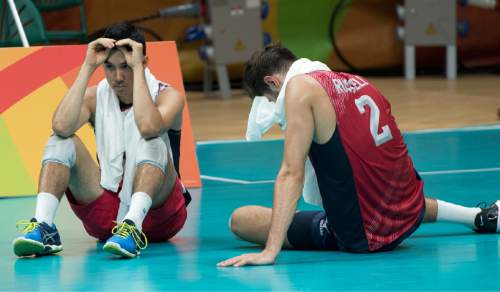 Rick Egan  |  The Salt Lake Tribune

Erik Shoji (22) and Aaron Russell (2) of United States sit on the court losing to Italy 2-3, in mens volleyball, at Maracanãzinho arena, in Rio de Janeiro, Friday, August 19, 2016.