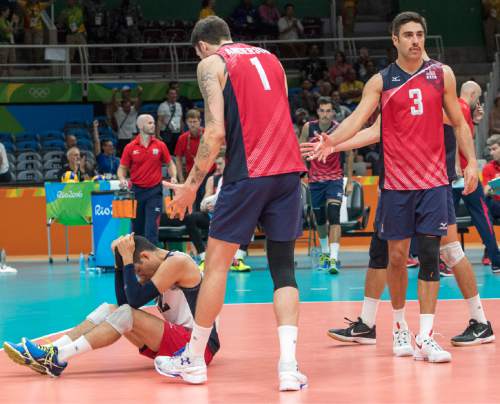 Rick Egan  |  The Salt Lake Tribune

Erik Shoji (22) of United States, sits not eh floor after Spain scored the game point to win game 4, in Volleyball action, at Maracanãzinho arena, in Rio de Janeiro, Friday, August 19, 2016.
