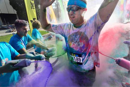 Scott Sommerdorf   |  The Salt Lake Tribune  
Runners cross through the last checkpoint where they were doused with colors at the Color Run, billed as "the largest 5K event series in the world" brought its 2016 tour theme, "The Color Run Tropicolor World Tour" to Salt Lake City, Saturday, August 20, 2016.