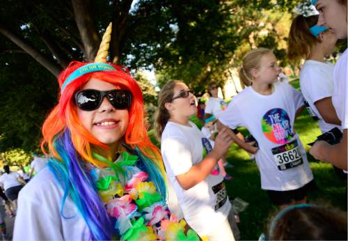 Scott Sommerdorf   |  The Salt Lake Tribune  
Abbie Andersen ran as a unicorn at the Color Run, billed as "the largest 5K event series in the world" brought its 2016 tour theme, "The Color Run Tropicolor World Tour" to Salt Lake City, Saturday, August 20, 2016.