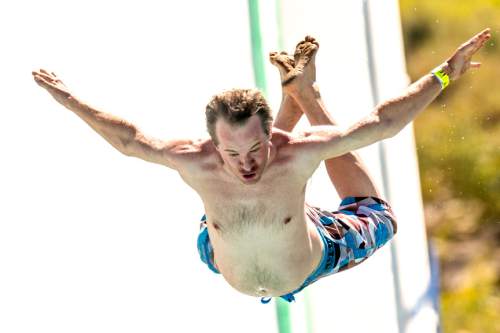 Chris Detrick  |  The Salt Lake Tribune
A man launches off a ramp into the one million gallon pool during Slip n' Soar at Utah Olympic Park Saturday August 20, 2016.