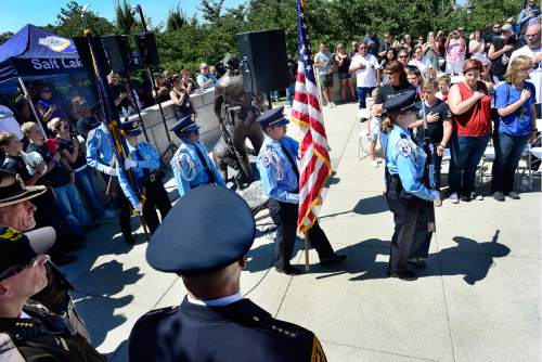 Scott Sommerdorf   |  The Salt Lake Tribune  
Salt lake City Police Department Explorers from Explorer Post #2471 bring in the colors at the beginning of the pinning ceremony at the Utah Law Enforcement Memorial "Ride for the Fallen", Sunday, August 21, 2016.