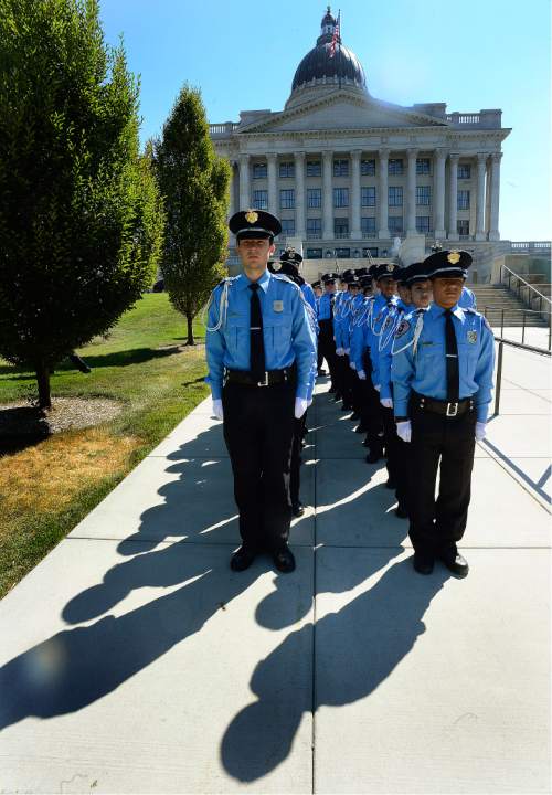 Scott Sommerdorf   |  The Salt Lake Tribune  
Members of the Police Department Explorer Post #2471 line up prior to the ceremony in which they were be presented the "Explorer Memorial Guardians" pins. The pins will be presented by the children of the fallen to the next generation of law enforcement officers during the Utah Law Enforcement Memorial "Ride for the Fallen", Sunday, August 21, 2016.