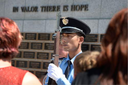 Scott Sommerdorf   |  The Salt Lake Tribune  
One of the Salt lake City Police Department Explorers from Explorer Post #2471 stands at attention at the beginning of the pinning ceremony at the Utah Law Enforcement Memorial "Ride for the Fallen", Sunday, August 21, 2016.