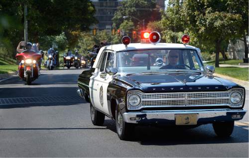 Scott Sommerdorf   |  The Salt Lake Tribune  
A vintage police squad car arrives at the capitol at the end of the "Ride for the Fallen", Sunday, August 21, 2016.