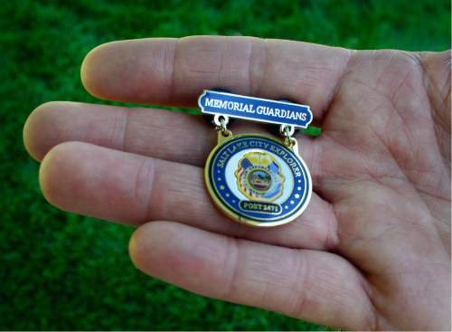 Scott Sommerdorf   |  The Salt Lake Tribune  
The Utah Law Enforcement Memorial will presented this "Explorer Memorial Guardians" pin to 14 new Salt lake City Police Department Explorers from Explorer Post #2471. The pins were presented by the children of the fallen to the next generation of law enforcement officers during the Utah Law Enforcement Memorial "Ride for the Fallen", Sunday, August 21, 2016.