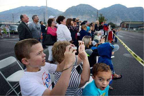 Scott Sommerdorf   |  The Salt Lake Tribune  
Family and friends of Provo Power employees get ready as the ten-second countdown to the demolition of the Provo Power Smokestacks began, Sunday, August 21, 2016.