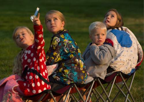 Leah Hogsten  |  The Salt Lake Tribune
The Rounds children, l-r Leah, Kyla, Linkin and Bailey look to the skies as hot air balloons launch early Friday, August 19, 2016 to kick off the Ogden Valley Balloon Festival, today through Sunday in Eden Park. The event features approximately 15 hot air balloons which are the focus for 5 launches and one balloon glow throughout the weekend.