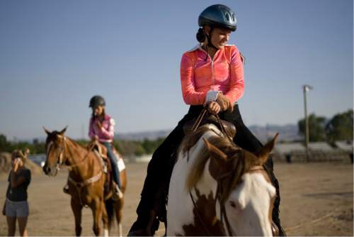 Kim Raff | The Salt Lake Tribune
Megan Larsen and Hidalgo wait to complete the horse trail course during the 4-H Horse Show at the South Jordan Equestrian Park in South Jordan, Utah on July 6, 2012.  4-H is celebrating its 100th anniversary of 4-H in Utah.