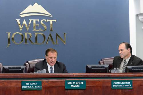 Trent Nelson  |  The Salt Lake Tribune
West Jordan Mayor Kim Rolfe reads a statement regarding Councilman Jeff Haaga's recent citation during a council meeting, Wednesday August 10, 2016. Haaga was recorded July 19 on police body camera video in which he appeared to be drunk. Officers cited him for hit-and-run after witnesses said he drove away from a local bar after hitting a car in the parking lot earlier that evening. At right is Councilman Chad Nichols.