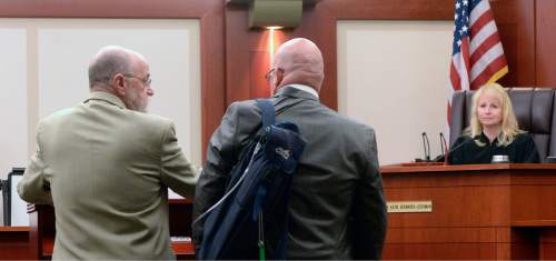 Al Hartmann  |  The Salt Lake Tribune
Defense lawyer Ron Yegich, left, stands with his client Timothy Lawson,  dubbed a "fixer" for former Utah Attorney General Mark Shurtleff in Judge Katie Bernards-Goodman's courtroom in Salt Lake City Monday April 25. 
Lawson is charged with six felonies -- including counts of tax evasion, witness tampering, obstruction of justice and a pattern of unlawful conduct -- stemming from allegations that he attempted to intimidate or threaten individuals with ties to Shurtleff and his successor, John Swallow.