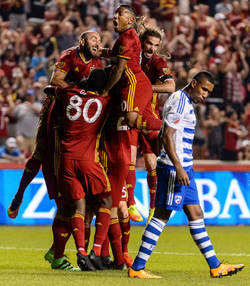 Trent Nelson  |  The Salt Lake Tribune
Real Salt Lake players jump on defender Jamison Olave (4) after his goal against FC Dallas at Rio Tinto Stadium in Sandy, Saturday August 20, 2016.