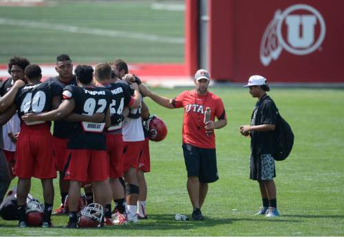 Francisco Kjolseth | The Salt Lake Tribune
The University of Utah football defensive coordinator Morgan Scalley, second from right, joins the team as they prepare to wrap up the last few days of fall camp on Friday, Aug. 19, 2016.
