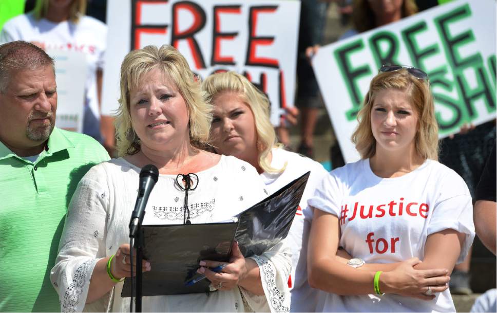 Scott Sommerdorf   |  The Salt Lake Tribune  
Laurie Holt, Josh Holt's mother speaks at a rally on the east steps of the Utah State Capitol in July calling for the release of her 24-year-old son Josh Holt, who is currently jailed in Venezuela. At left is her husband Jason Holt, with Josh's sisters Katie, and Jenna Holt, far right.