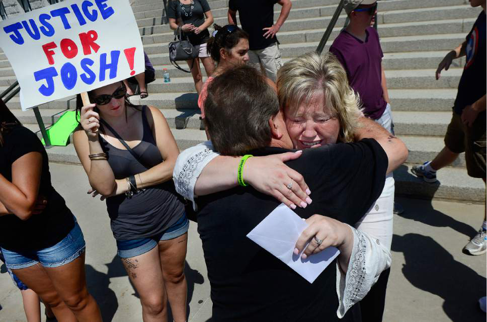 Scott Sommerdorf   |  The Salt Lake Tribune  
Josh Holt's mother Laurie Holt hugs her uncle Leonard Bell after a rally on the east steps of the Utah State Capitol that called for the release of their 24-year-old son Josh Holt, who is currently jailed in Venezuela on Saturday.