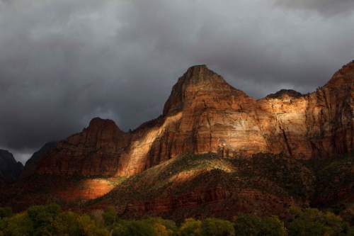 Trent Nelson  |  The Salt Lake Tribune
The late afternoon sun lights up the entrance to Zion National Park, Thursday, October 10, 2013.  The National Park Service handled a record number of visitors last year and expects to break records again in 2016, its centennial year.
