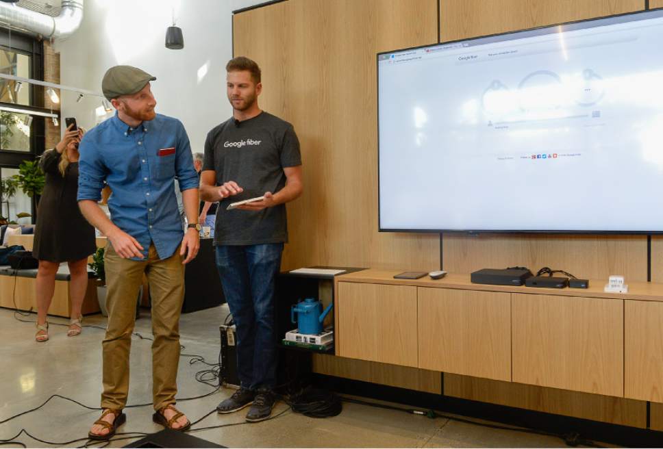 Francisco Kjolseth | The Salt Lake Tribune
SLC Councilman Derek Kitchen, left, conducts a "speed test" of Google Fiber's scorching-fast gigabit service alongside Brand Ambassador Morgan Ence, during a grand opening-type event at their offices in Trolley Square, referred to as Fiber Space, on Wednesday, Aug. 23, 2016. The initial Google service area falls primarily within Derek Kitchen's district.