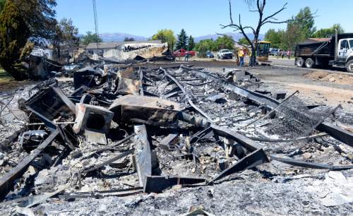 Al Hartmann  |  The Salt Lake Tribune 
Officials suspect arson destroyed 10 homes and other property in a neighborhood in Tooele, Utah, on Wednesday, July 20, 2016.