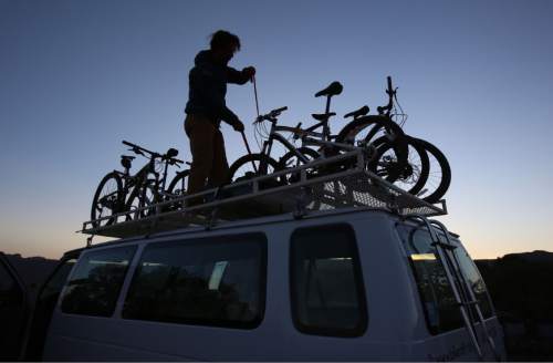 Francisco Kjolseth  |  The Salt Lake Tribune
Holiday Expeditions guide Dave Snee gets mountain bikes ready for the third day of a four-day trip at Murphys Campground on the White Rim Trail in Canyonlands National Park in May, 2013.