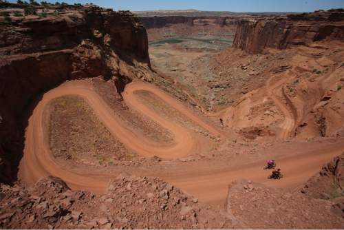 Francisco Kjolseth  |  The Salt Lake Tribune
Mountain bikers near the end of their 75-mile trip as they make the steep climb on the Mineral Bottom Road after riding the White Rim Trail in Canyonlands National Park in May 2013.
