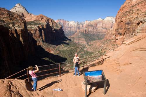 Al Hartmann  |  The Salt Lake Tribune
Hikers pose for a picture looking into Zion Canyon from the Canyon Overlook Trail.