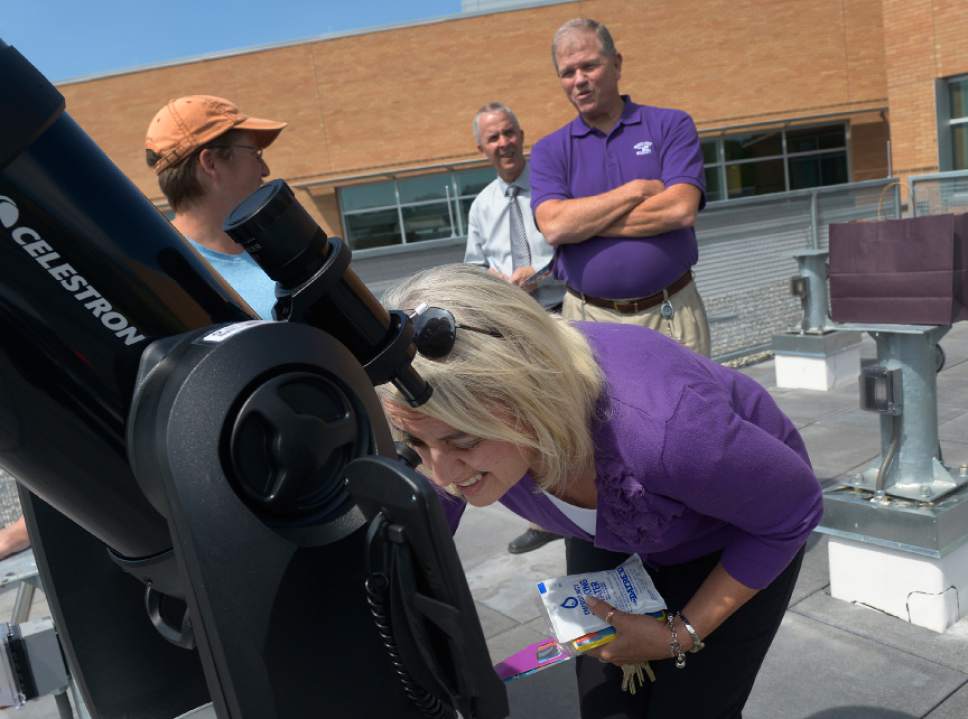 Leah Hogsten  |  The Salt Lake Tribune
Nursing professor Diane Leggett-Fife views the sun's spots through a telescope on Public Observatory platform of Tracy Hall Science Center on the campus of Weber State University after the completion of the Science Center for scientific, mathematical and engineering learning and research, Wednesday, August 24, 2016.