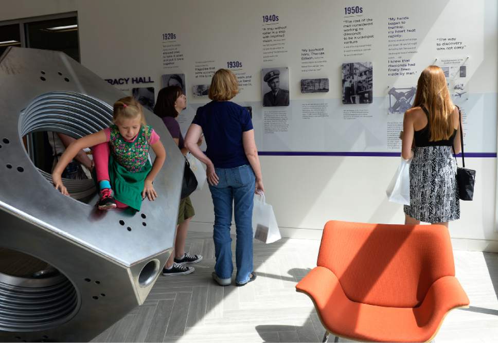 Leah Hogsten  |  The Salt Lake Tribune
A timeline of Tracy Hall's life greets visitor to the entrance of the center. Hall, a Weber State University alumnus, was the first man to press a synthetic diamond with his patented diamond press, shown at left. Weber State University celebrated the completion of the Tracy Hall Science Center for scientific, mathematical and engineering learning and research, Wednesday, August 24, 2016.