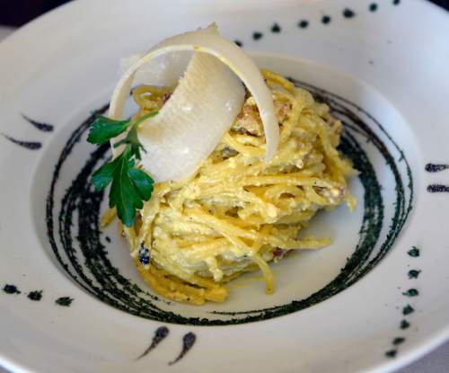 Al Hartmann  |  The Salt Lake Tribune 
Spaghetti alla carbonara prepared tableside with homemade spaghetti with eggs, pancetta and parmigiano reggiano at Sicilia Mia in Millcreek.
