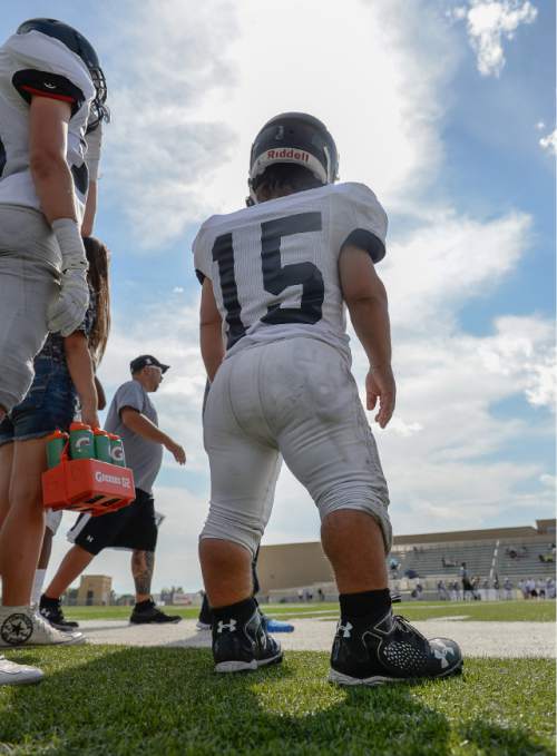 Francisco Kjolseth | The Salt Lake Tribune
Highland junior defensive tackle Zach Schreiter is 4-foot-3 and 115 pounds. He was born a little person, but he isn't allowing his size to deter him from playing the sport he loves, as helps his team on the field during a recent game against Olympus.