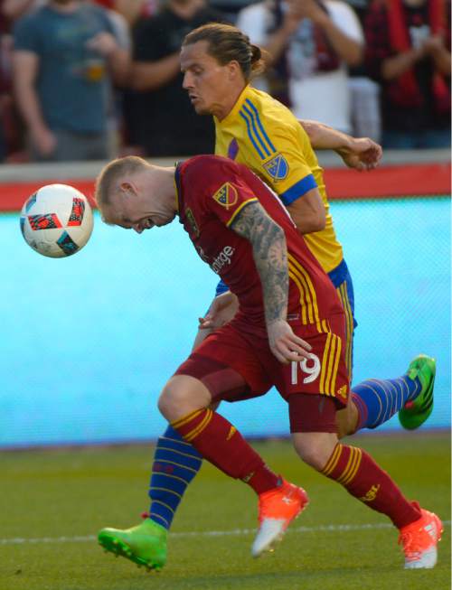 Leah Hogsten  |  The Salt Lake Tribune
Real Salt Lake midfielder Luke Mulholland (19) heads the ball while fighting for possession with Colorado Rapids defender Marc Burch (4). Real Salt Lake defeated the Colorado Rapids 2-1 during their Rocky Mountain Championship Cup game at Rio Tinto Stadium Friday, August 26, 2016.