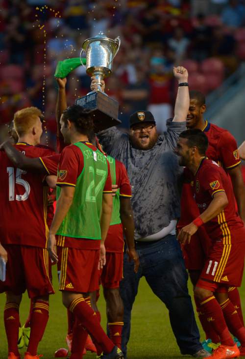 Leah Hogsten  |  The Salt Lake Tribune
Real Salt Lake players celebrate winning the Rocky Mountain Cup. Real Salt Lake defeated the Colorado Rapids 2-1 during their Rocky Mountain Championship Cup game at Rio Tinto Stadium Friday, August 26, 2016.