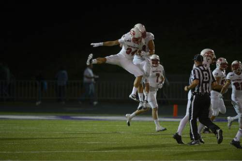 Leah Hogsten  |  The Salt Lake Tribune
Southern Utah Thunderbirds linebacker Mike Needham (34) celebrates with Southern Utah Thunderbirds defensive end James Cowser (53) after Needham intercepted a pass intended for Weber State Wildcats wide receiver Darryl Denby (3). Southern Utah University defeated Weber State University 44-0, October 2, 2015 at Stewart Stadium in Ogden.